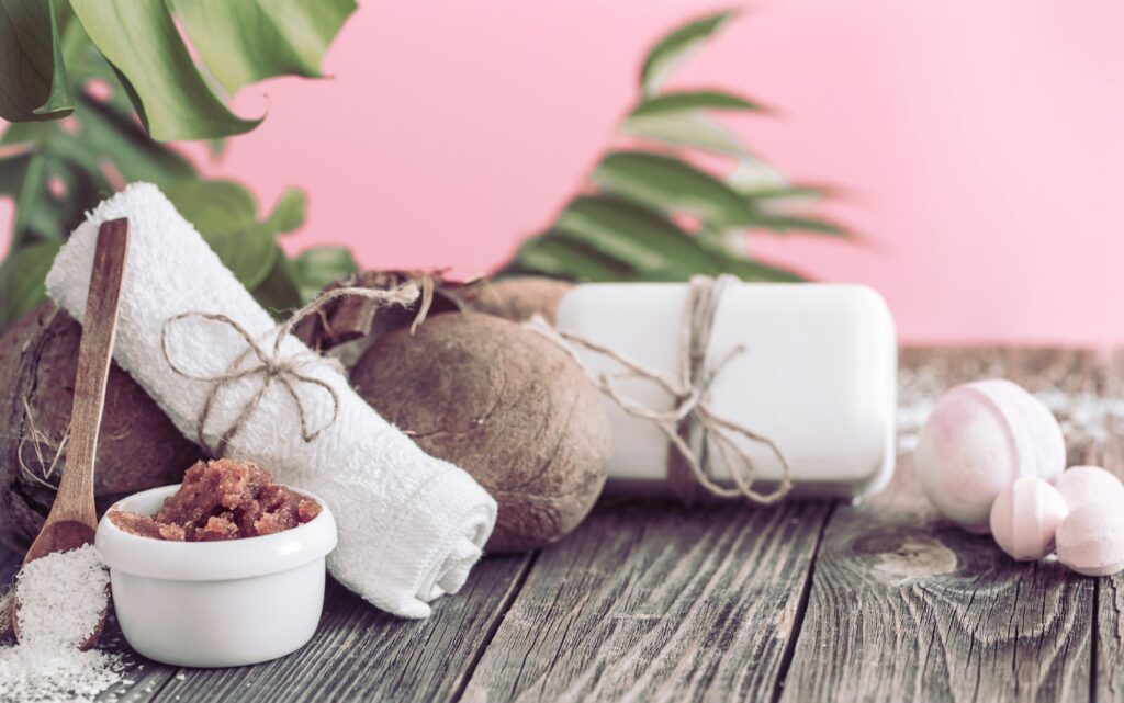 Spa and wellness setting with flowers and towels.