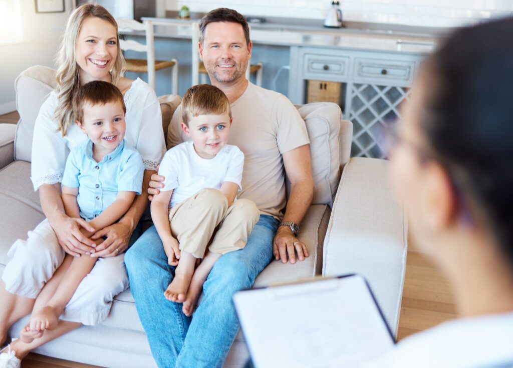 Family requires work. Shot of a family having a therapy session at home.